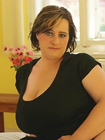 Huge breasted mama showing off her assets