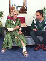 Super hot blonde grandma in her sexy glasses fucked by the young man with an active cock